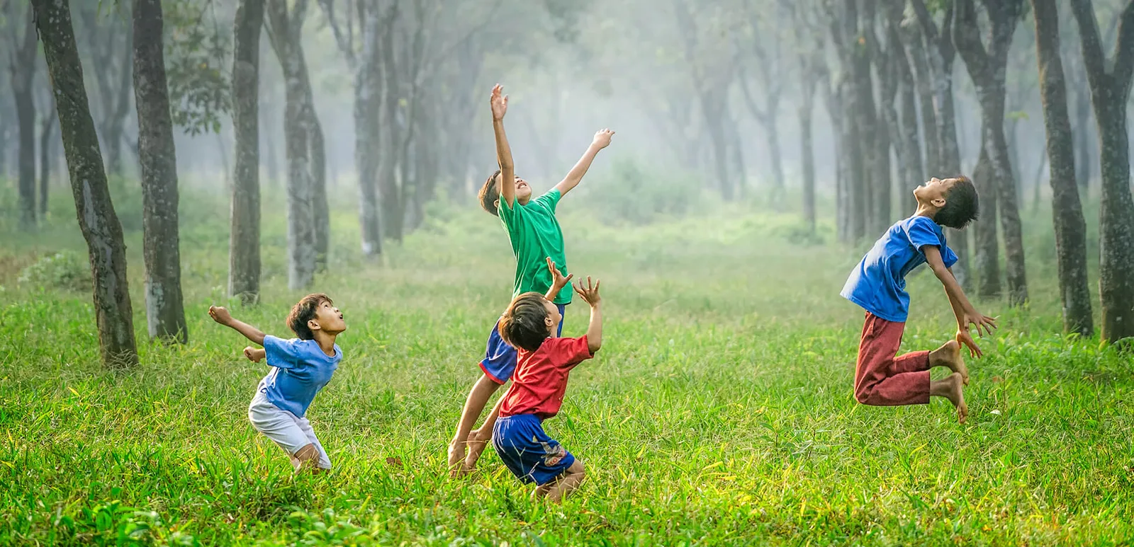 Children playing happily outdoors in nature