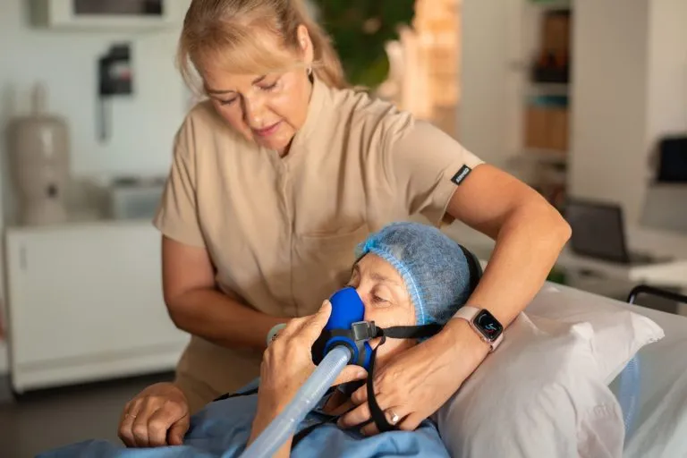 Oxygen mask being fitted before a hyperbaric oxygen therapy session