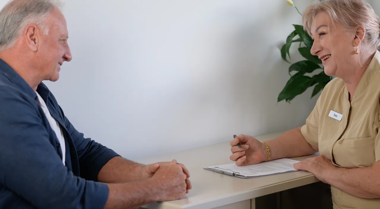 Practitioner speaking with a patient during a one-on-one consultation at the clinic