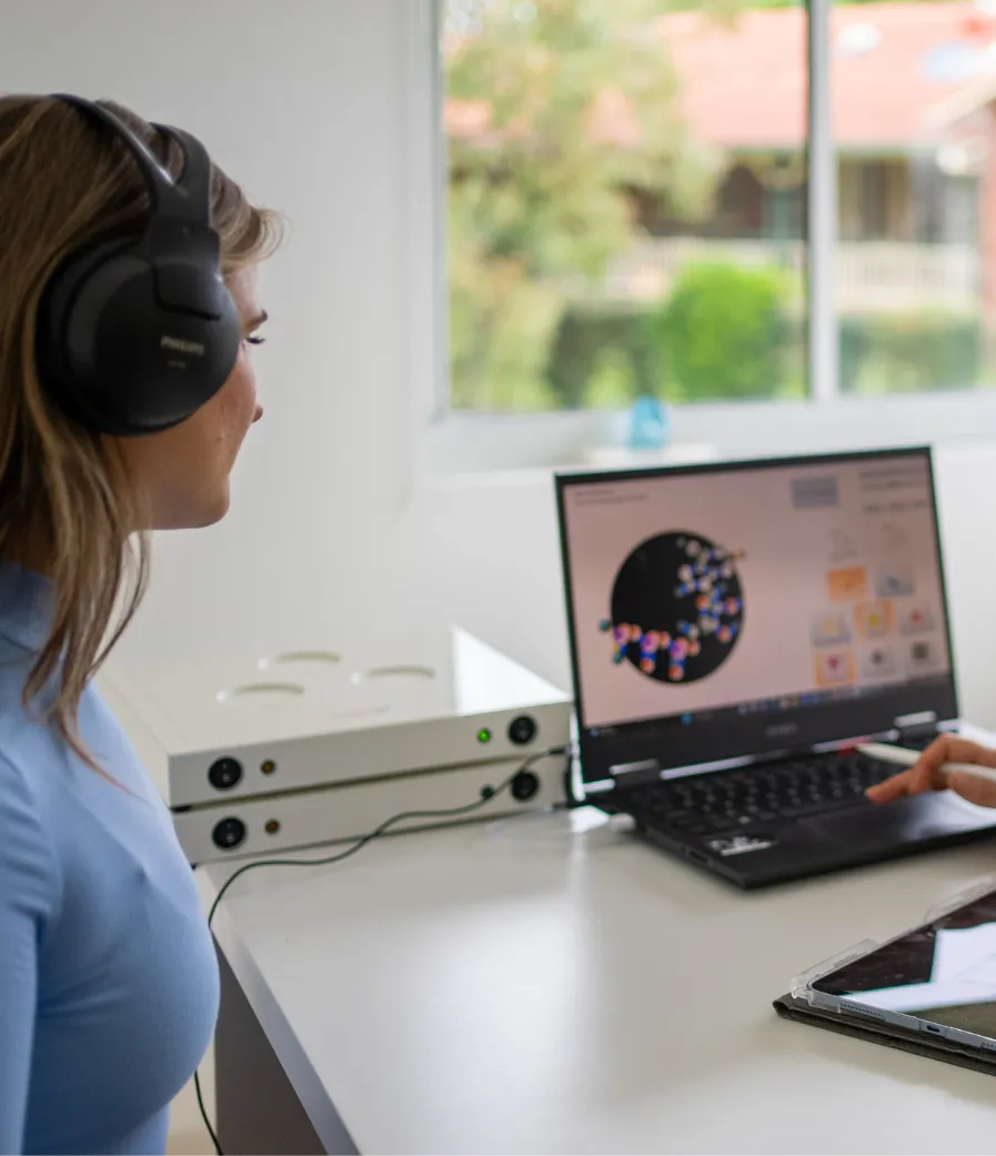 Patient wearing headphones during a session at the Inspiring Choices Gold Coast clinic