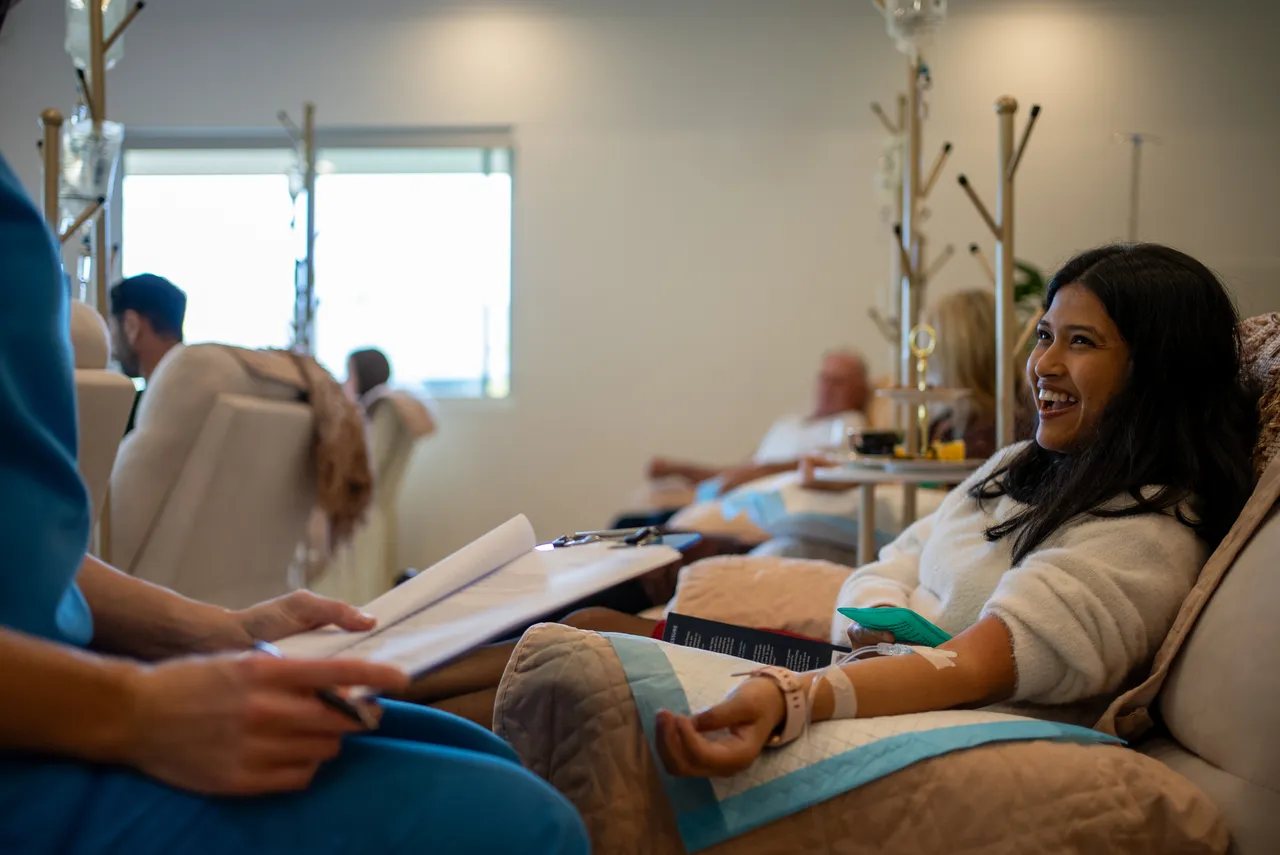 Patient seated comfortably while receiving vitamin IV therapy