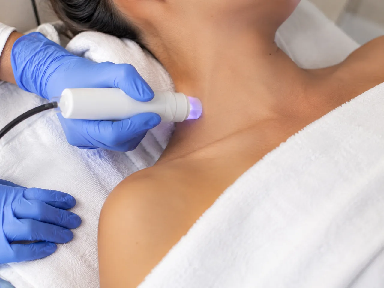 Lymphatic enhancement therapy applied to a patient's face and neck