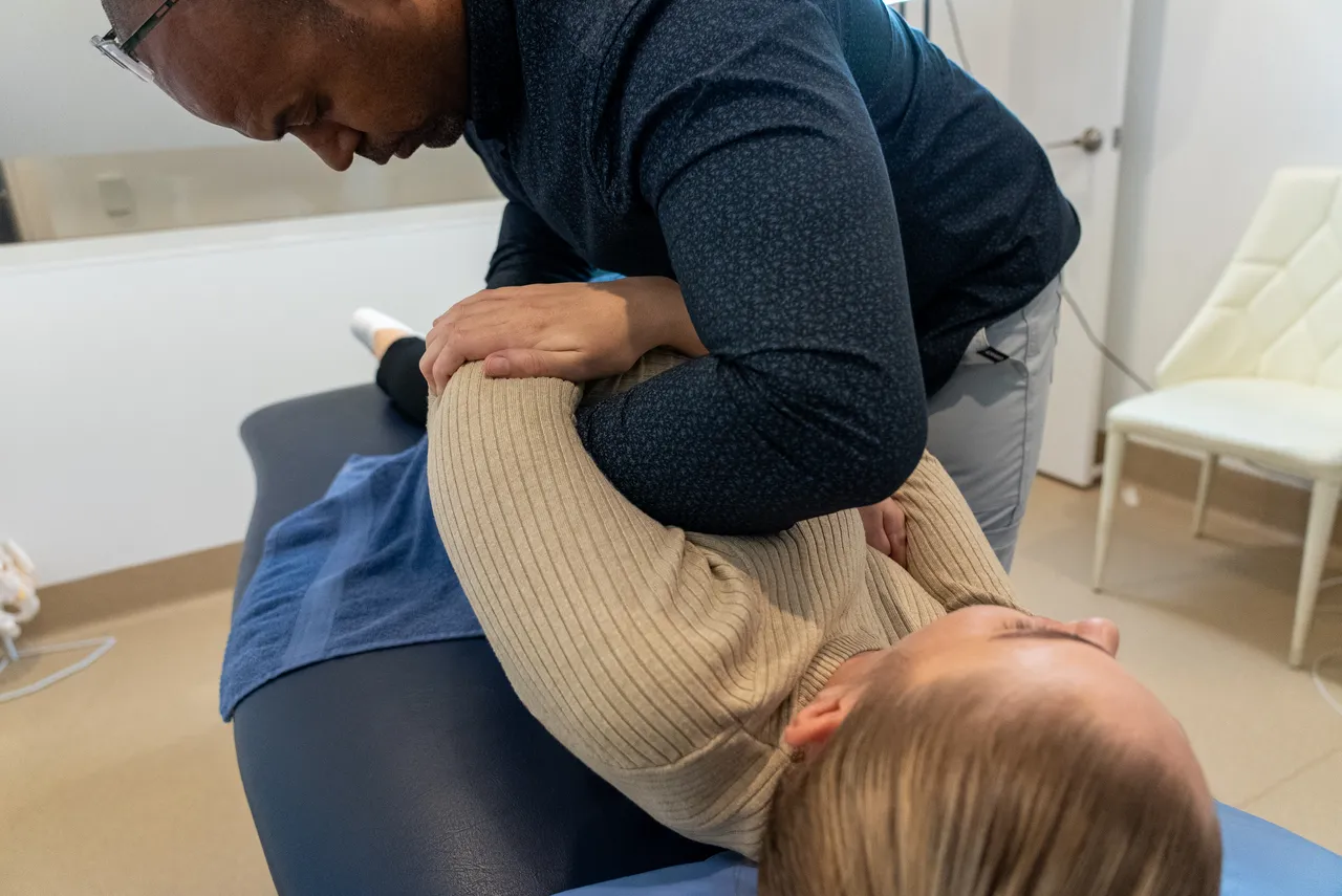 Hands-on osteopathic shoulder treatment at the Gold Coast clinic